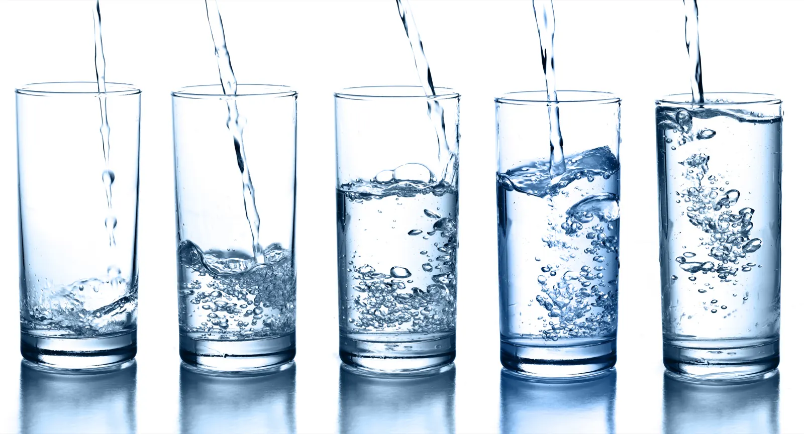 Glasses of clean water being filled at the tap