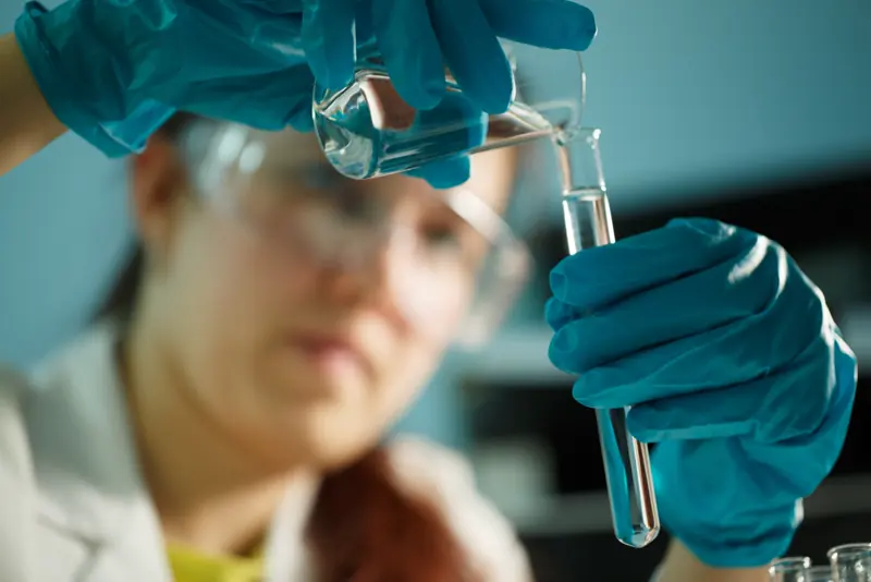 Technician analyzing a water sample from a tri-state home